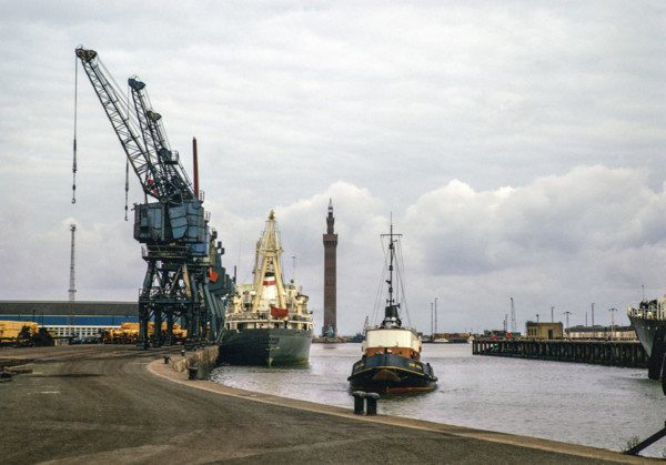 Cargo ships and 'Lady Sybil' tug boat, Royal Dock with Grimsby Dock Tower, Grimsby, Lincolnshire,