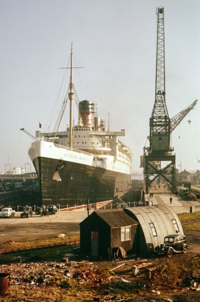 RMS Queen Mary ocean liner ship in dry dock, Southampton docks, Hampshire, England, UK 1950s.