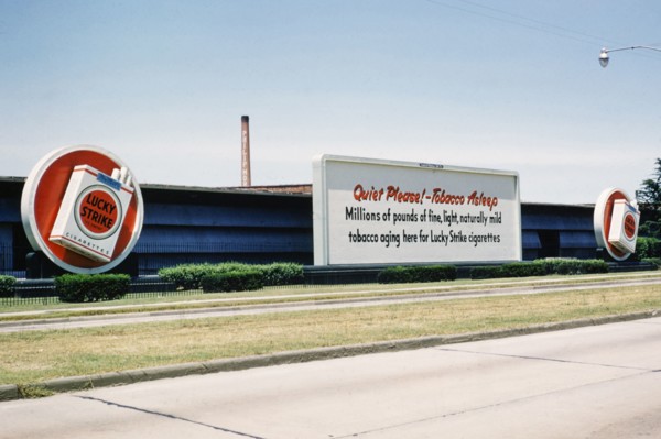 Lucky Strike cigarette advert, Philip Morris tobacco factory, thought to be Durham, North Carolina.