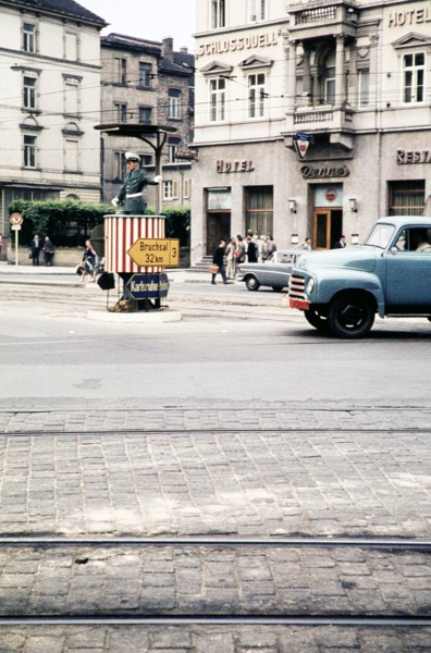 Traffic policeman in street in front of hotels, Bergheimer Strasse, Heidelberg, Baden-Württemberg,