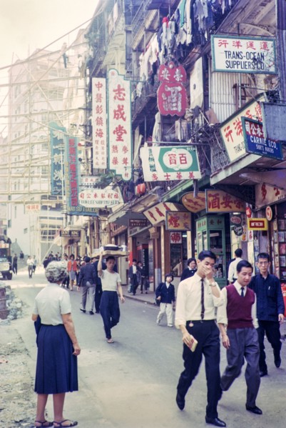 Captioned as 'Chinese flower stalls', Victoria, Hong Kong, Asia 1964 - note bamboo scaffolding.
