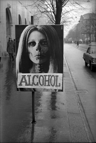 Poster warning of drug abuse has been taped over with the word alcohol, 1969