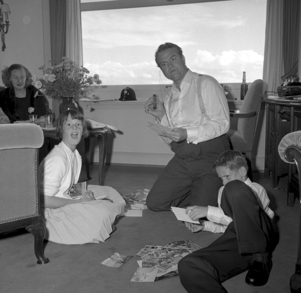 Red Skelton with his family in hotel room, Zurich 1957