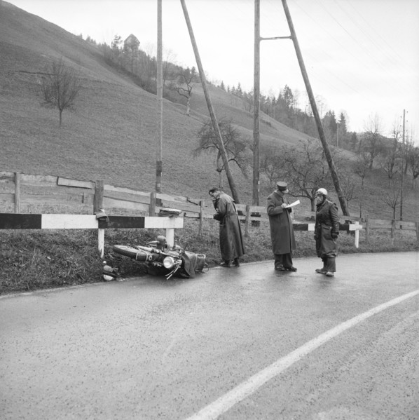 Policeman making the accident report, motorbike accident near Trogen 1956