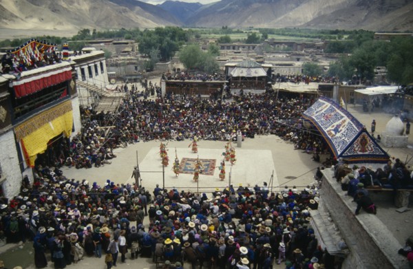 CHINA, Tibet, Samye Monastery, Crowds and dancers at Tibetan Full Moon Festival.