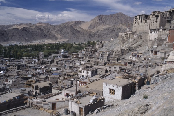 INDIA, Ladakh, Leh, Hillside Palace overlooking the town surrounded by mountainous terrain