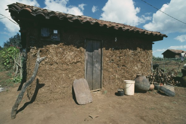 MEXICO, Paraje , Exterior of a Chamula Indians house with mud walls and tiled roof