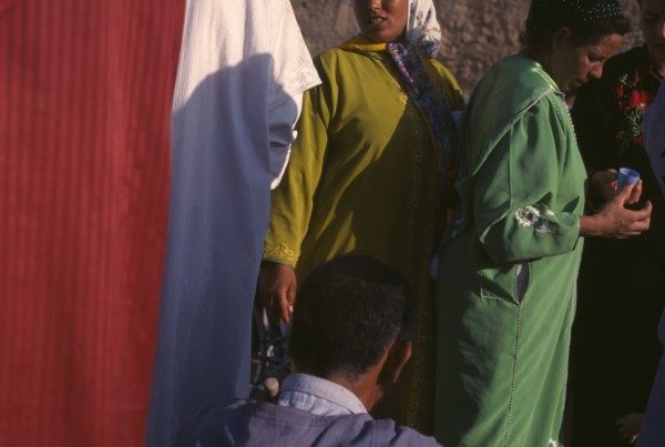 MOROCCO, General, Women at souk in bright coloured clothing