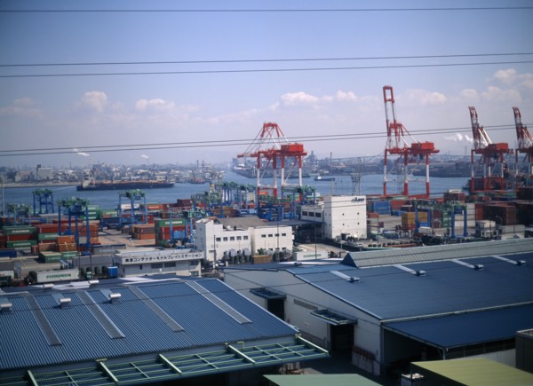 JAPAN, Osaka, Osaka Bay, "Aerial view over the docks with warehouses, containers, cranes and ships.