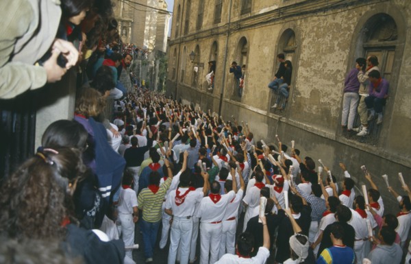 SPAIN, Navarra, Pamplona , San Fermin Bull Run Festival prayers in a narrow street  before bull run