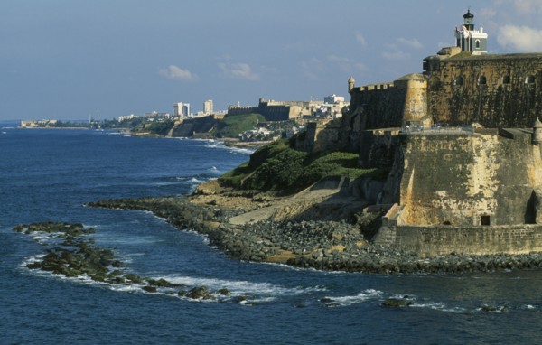 WEST INDIES, Puerto Rico, San Juan, View along San Juan coastline with fort and old city walls.