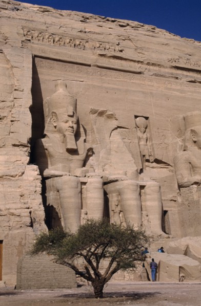 EGYPT, Nile Valley, Abu Simbel, Sitting statues of Ramses the second at the temple carved in to a
