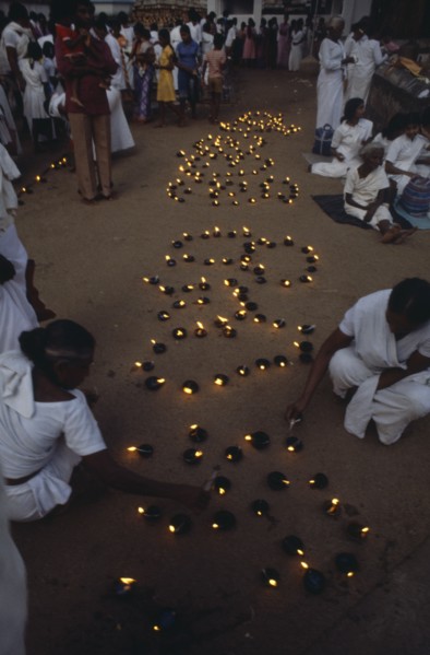 SRI LANKA, Anuradhapura, Lighting lamps during Wessac.