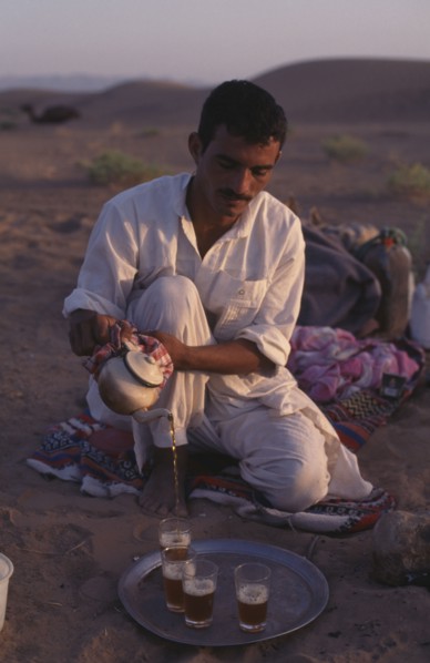 EGYPT, Sahara Desert , Berber guide pouring tea