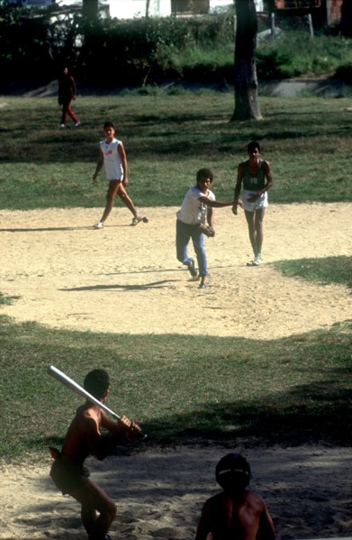CUBA, Pinar del Rio, Young men playing a game of baseball