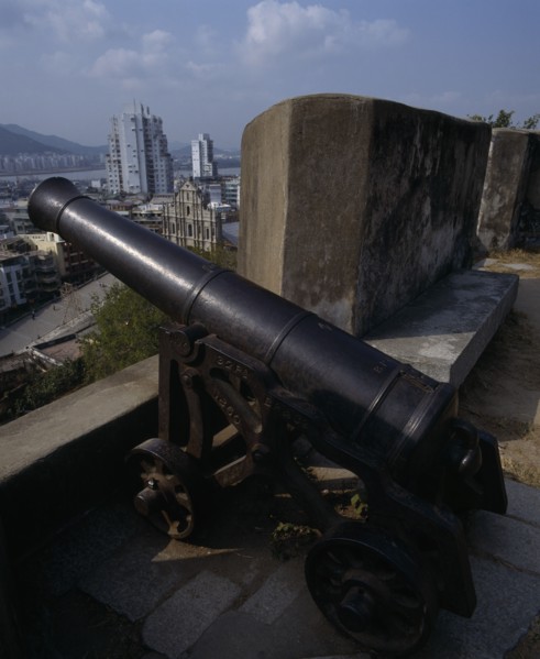 MACAU, Sao Paulo , Fortaleza Do Monte. Black cannon with view to Sao Paulo Church below