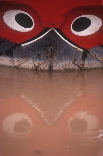 VIETNAM, My Tho, Detail of boat with traditional painted decoration depicting a pair of guarding