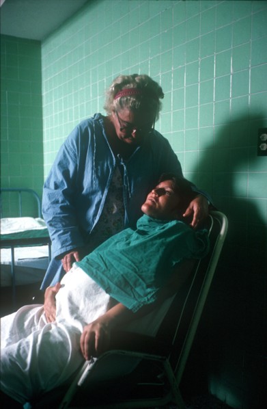CUBA, Havana, Pregnant woman in labour being attended by hospital nurse