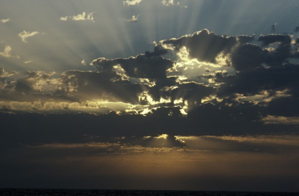 WEATHER , Climate, Clouds, Sun beams through clouds over the sea