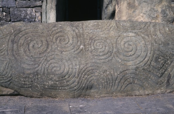 IRELAND, County Meath, Boyne Valley , Newgrange world heritage site. Carved stone at entrance of