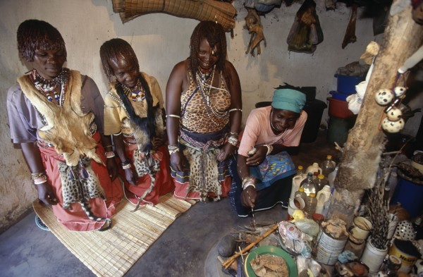 SOUTH AFRICA, KwaZulu Natal , Hlabisa, Zulu Sangomas or female diviners kneeling in their