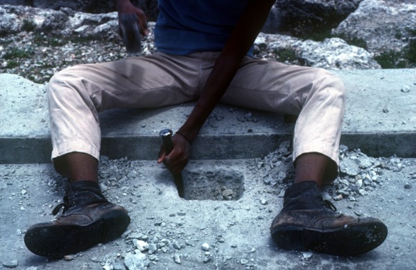 CUBA, Work, Detail of construction worker chiseling into concrete