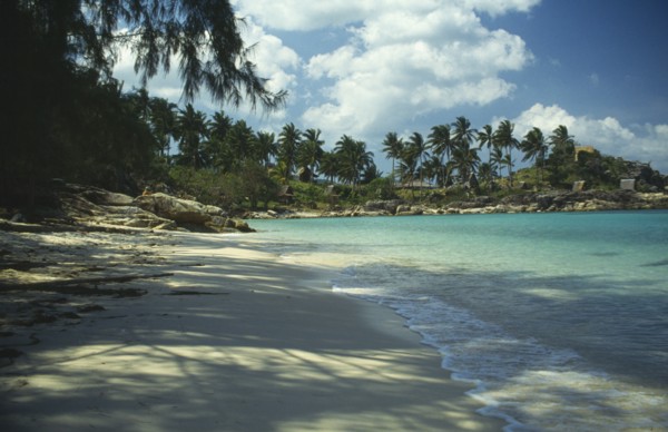 THAILAND, Koh Pha-Ngan Island, Coral Bay.  View along sandy beach toward bay with surrounding rocks