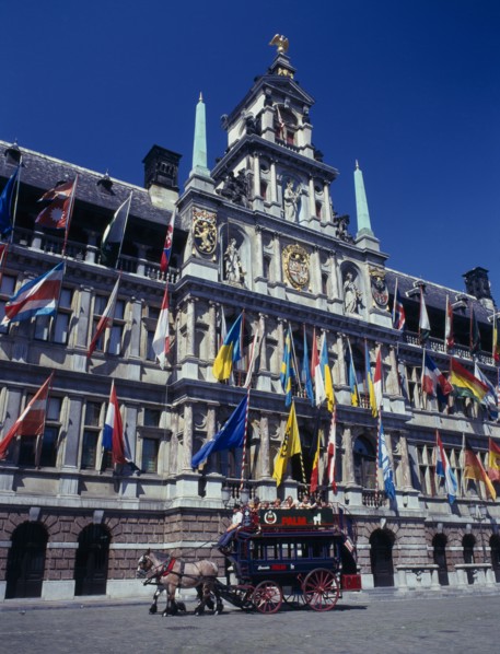 BELGIUM, Flemish Region, Antwerp, A horse drawn tourist coach in front of the Town Hall which is