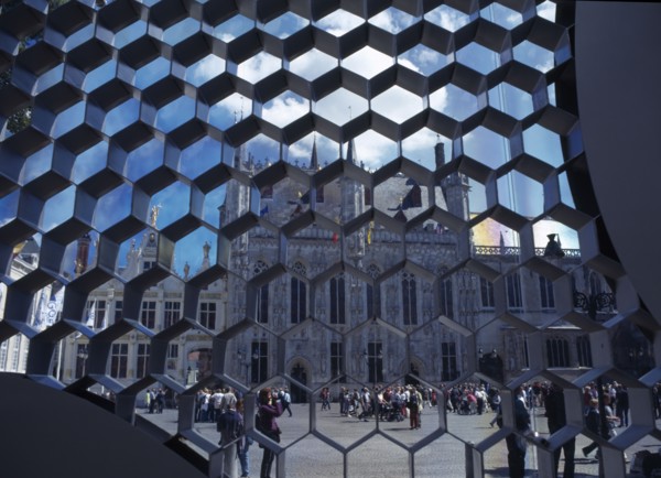 BELGIUM, West Flanders, Bruges, Burg Square with the Stadhuis seen through honeycombe detail of