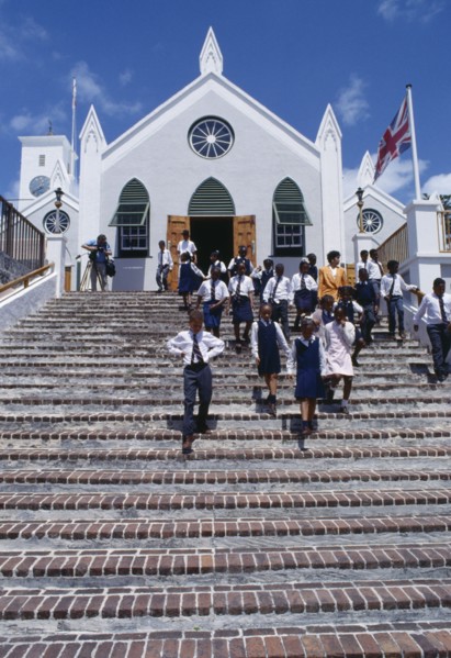 BERMUDA, St Georges Island, St Georges, Schoolchildren in uniform leaving St. Peters Cathedral.