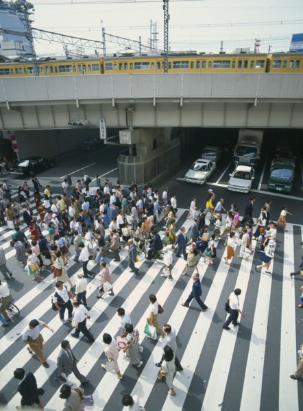JAPAN, Honshu, Osaka, Umeda District Railway Line over a road with traffic under the bridge and a