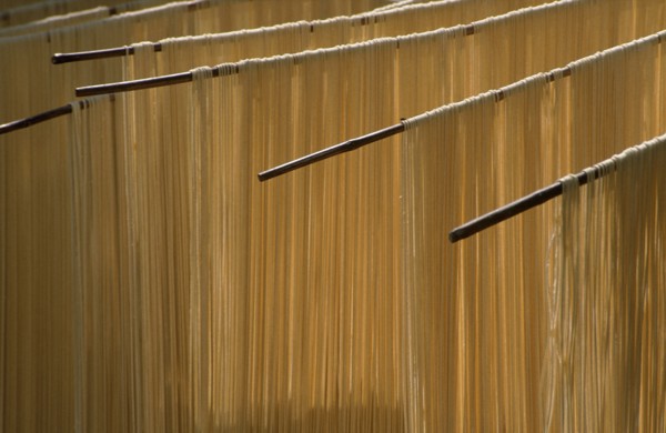 CHINA, Guizhou , Noodles hanging to dry in the open air