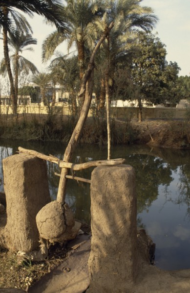 EGYPT, Nile Valley, Agriculture, Shaduf and irrigation canal.