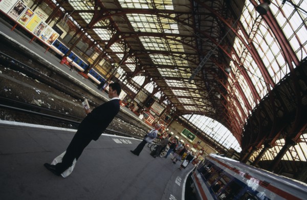 TRANSPORT, Rail, Station, Railway station with angled view of passengers waiting on empty platform
