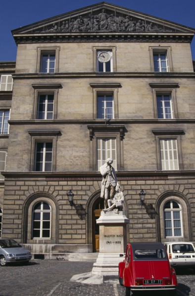 FRANCE, Il de France, Paris, Statue of Valentin Hauy outside the Institute for the Blind building.