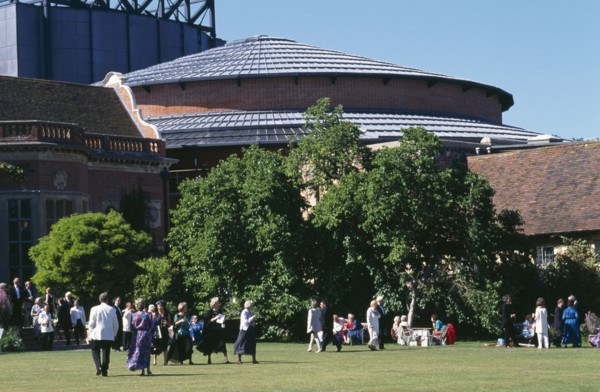 ENGLAND, East Sussex, Glyndebourne, "New theatre, exterior with audience members crossing the lawn