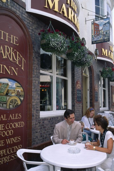 ENGLAND, East Sussex, Brighton, Couple outsdie the Cricketers Pub.