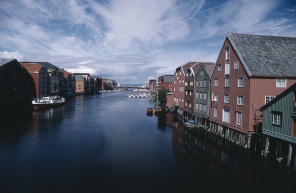 NORWAY, Sor Trondelag, Trondheim , Wharf area. Traditional wooden waterfront buildings with bridge