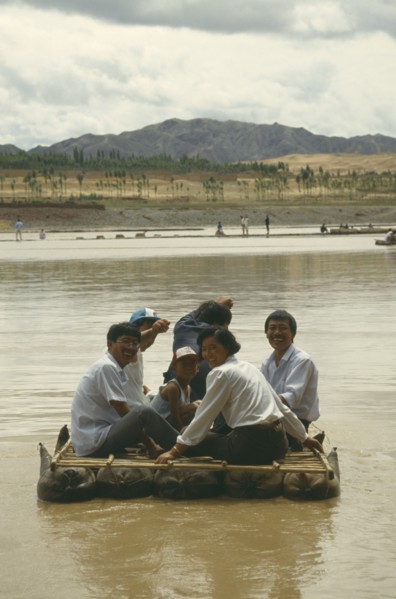 CHINA, Yellow River, People traveling down river on Hide Raft