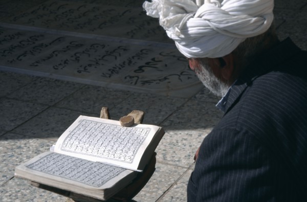 IRAN,   , Yazd, Man reading Koran