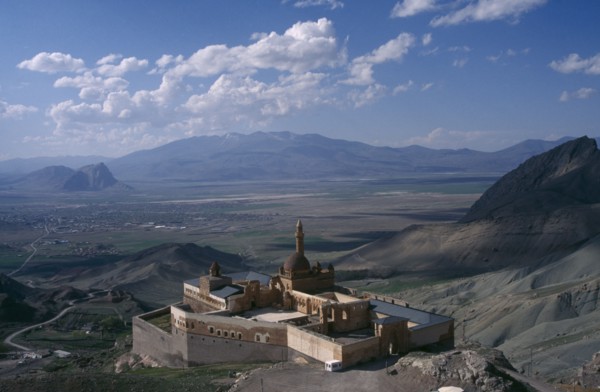 TURKEY, Dogubeyazit, Ishak Pasha Palace. View over hillside palace toward valley and mountains in