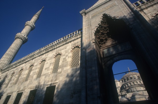 TURKEY, Istanbul  , Blue Mosque or Sultan Ahmet Cami mosque. Angled view looking up toward archway