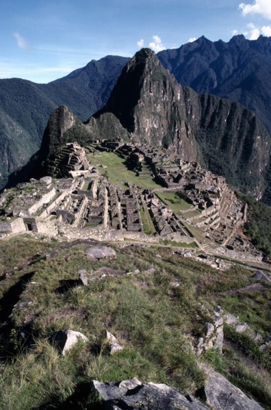 PERU, Cusco, Machu Picchu, General view over the Inca ruins set in rocky mountain landscape