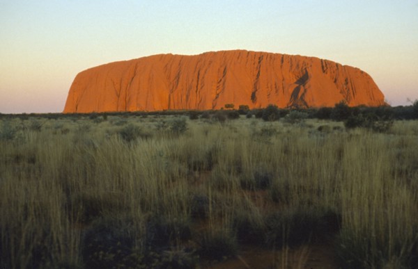 AUSTRALIA, Northern Territory, Uluru, Ayers Rock at sunset.