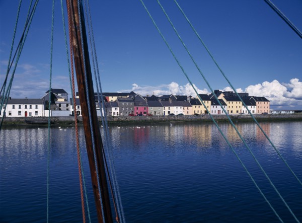 IRELAND, County Galway, Galway City, View across the River Corrib toward colourful houses near the