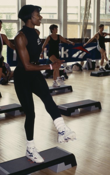 10001952 SPORT Excercise Gym A young black woman taking part in a step workout
