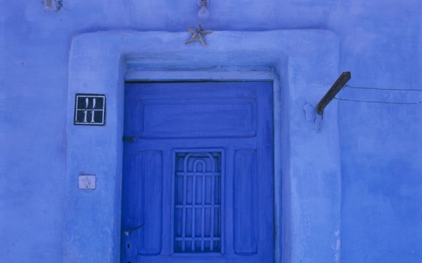 EGYPT, Eastern Desert, Hurghada, Detail of blue painted house and entrance with a starfish above a