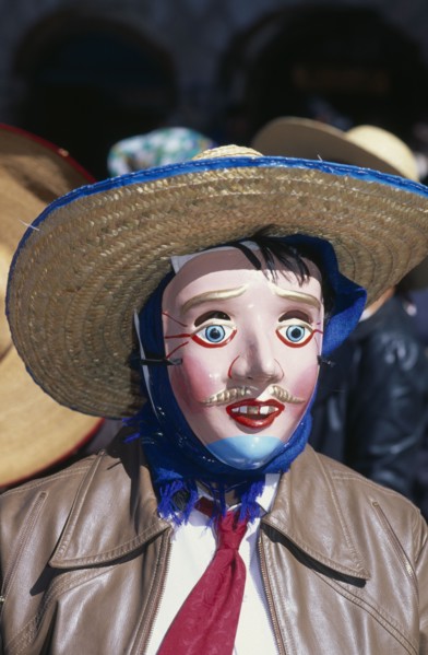 PERU, Cusco, Masked figure at Inti Raymi.  Head and shoulders shot.    Cuzco