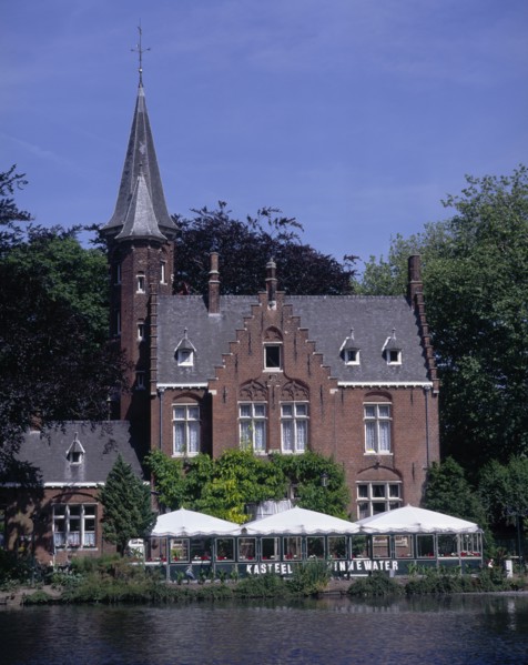 BELGIUM, West Flanders, Bruges, "View across Minnewater or Love Lake, towards red brick building