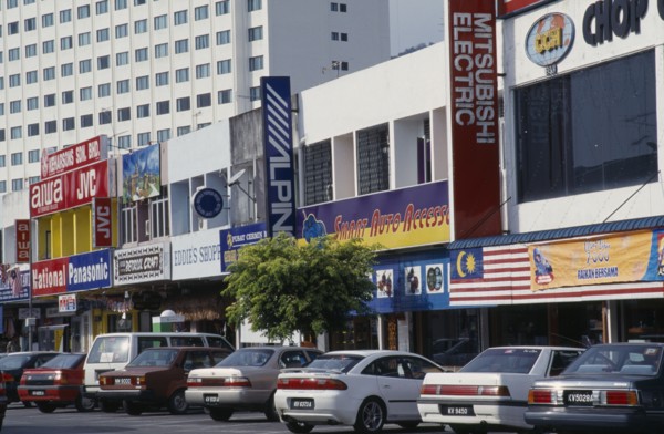 MALAYSIA, Kedah, Langkawi, Kuah old town electrical goods shops with cars parked in front